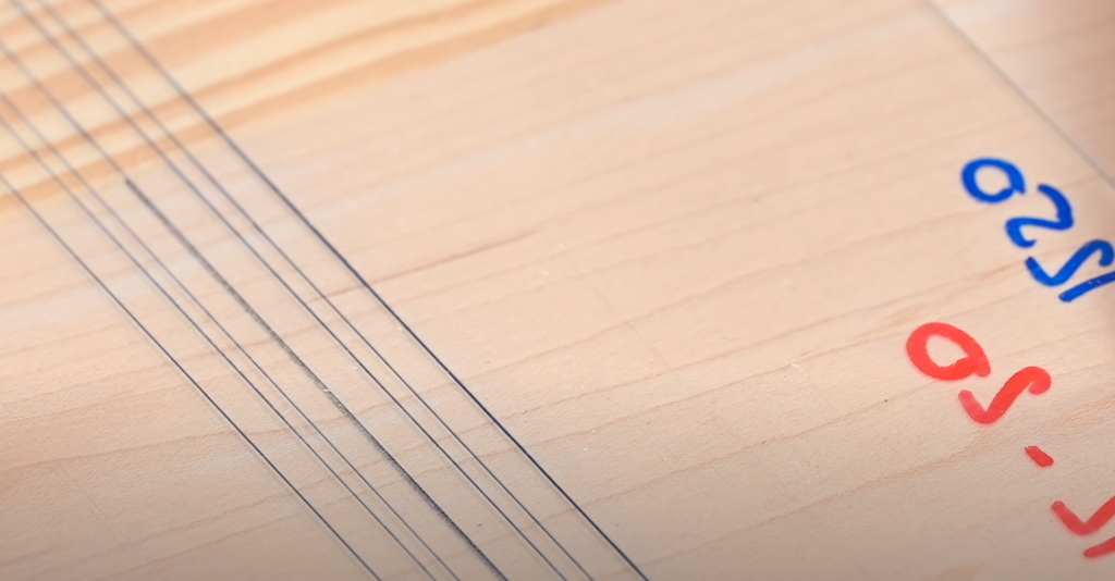 Gabarit en plexiglas pour défonceuse avec l'axe central et diamètres de fraises tracés